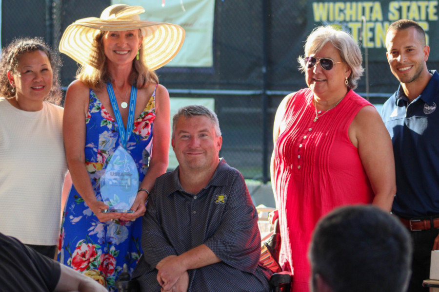 Wheelchair tennis legend Nick Taylor (center) was recognized for a decade as Wichita Tennis Open tournament director as part of the WTO's festivities.