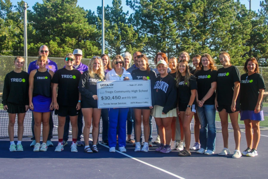 When coach Amelia Dirks saw her school's tennis courts needed attention, she took action—securing a USTA grant that transformed Trego Community High School's facility.